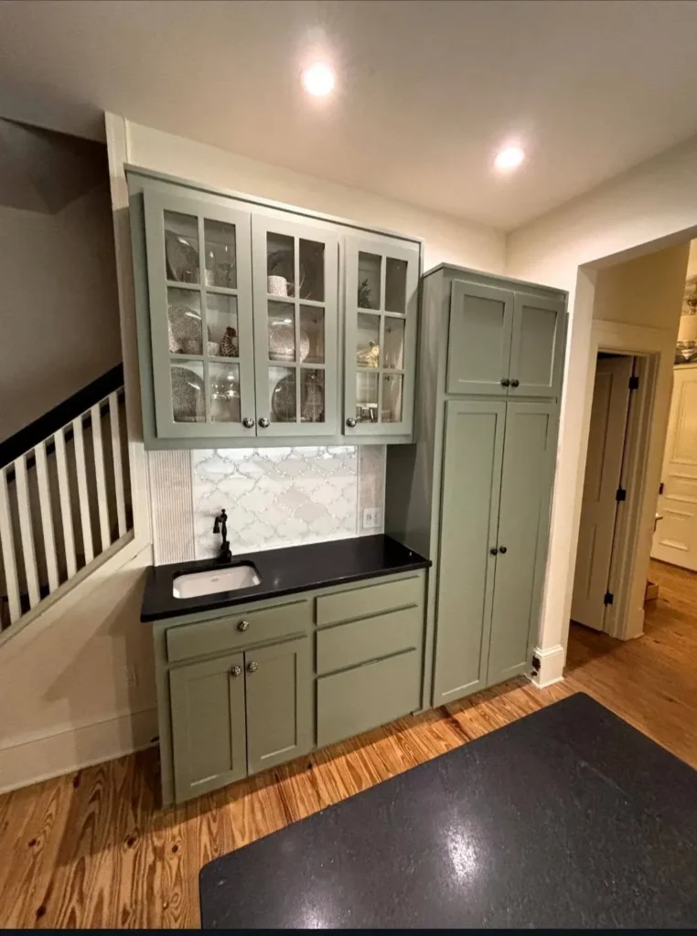 Beautiful sage green painted kitchen cabinets and wet bar Best Cabinet Colors